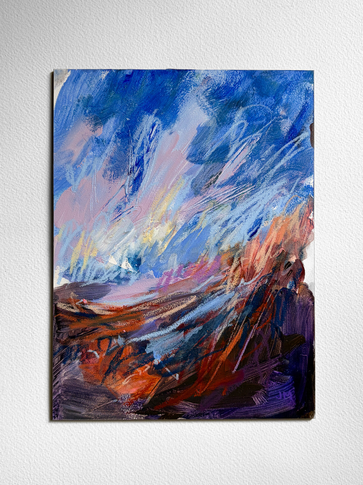 vibrant, expressive landscape on board with blue sky and brown grassy ground
