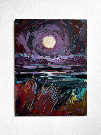 An expressive painting of a moonlit landscape, featuring a glowing pale moon in a swirling violet sky over reflective water with red, teal, and gold brushstrokes in the foreground, displayed on a white wall.