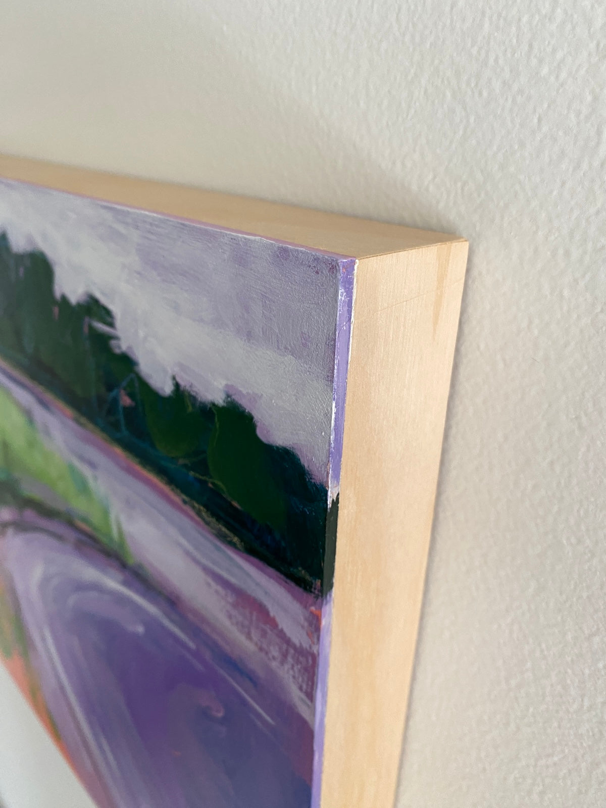 Close-up view of corner of landscape painting
